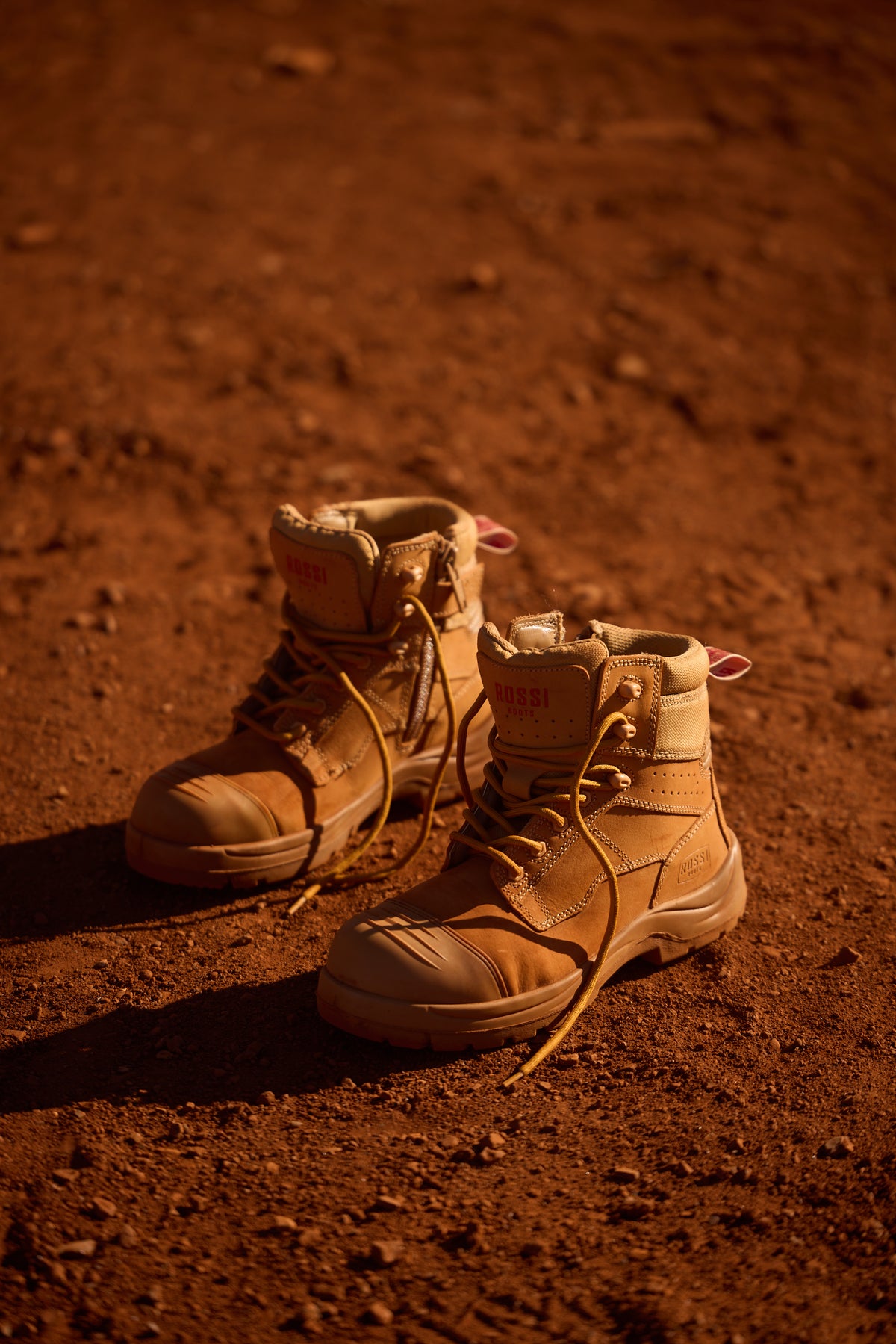 Wheat work boot on red Australian dirt