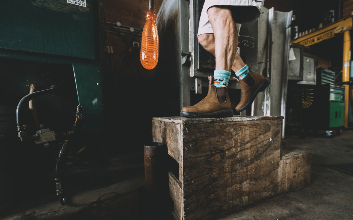 Ketih Rowe working with molten glass, wearing his Rossi Boots